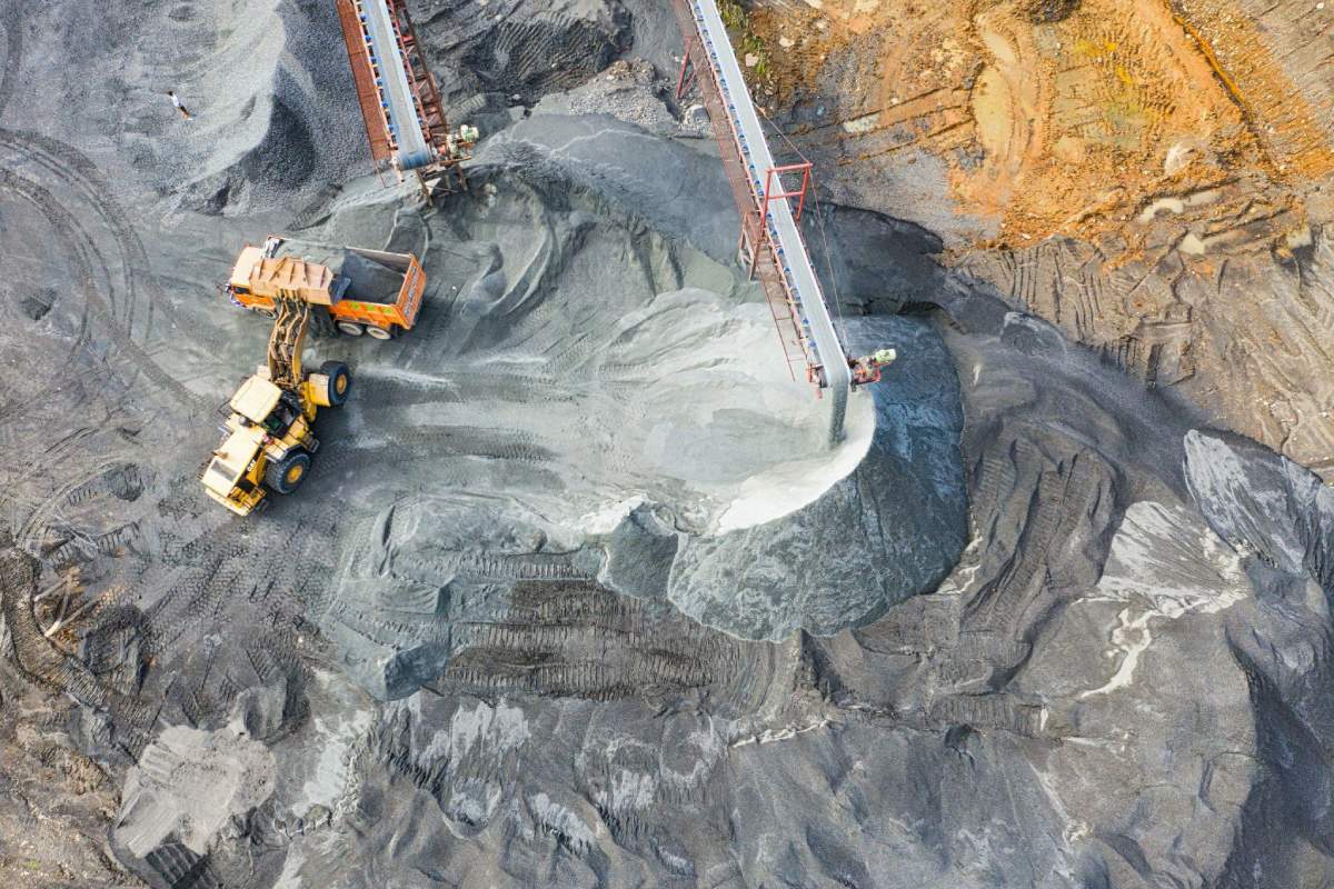 Yellow Excavator Loading Sand